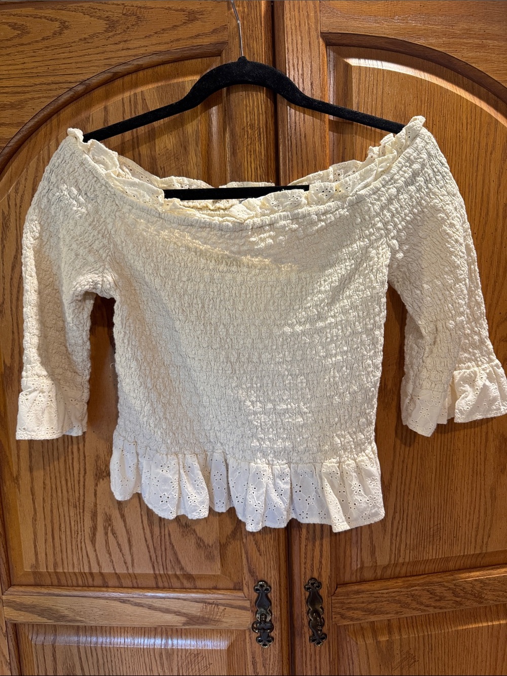 American Eagle Smocked Off-Shoulder Eyelet Ruffle Top in Cream